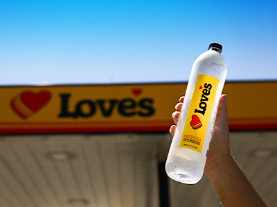 love's premium water bottle next to loves canopy