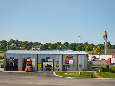 Speedco shop with open service bays in Love's Travel Stops parking lot
