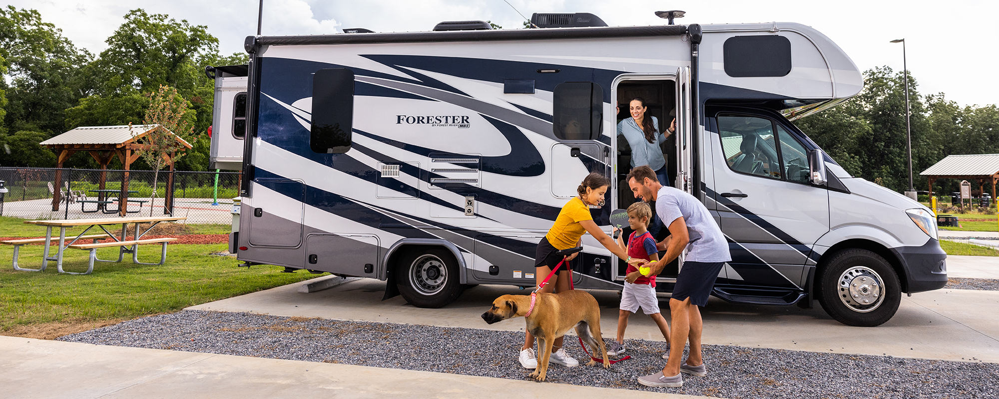 Family in front of an RV.