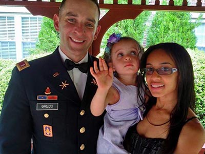 us army officer in blues with wife and daughter